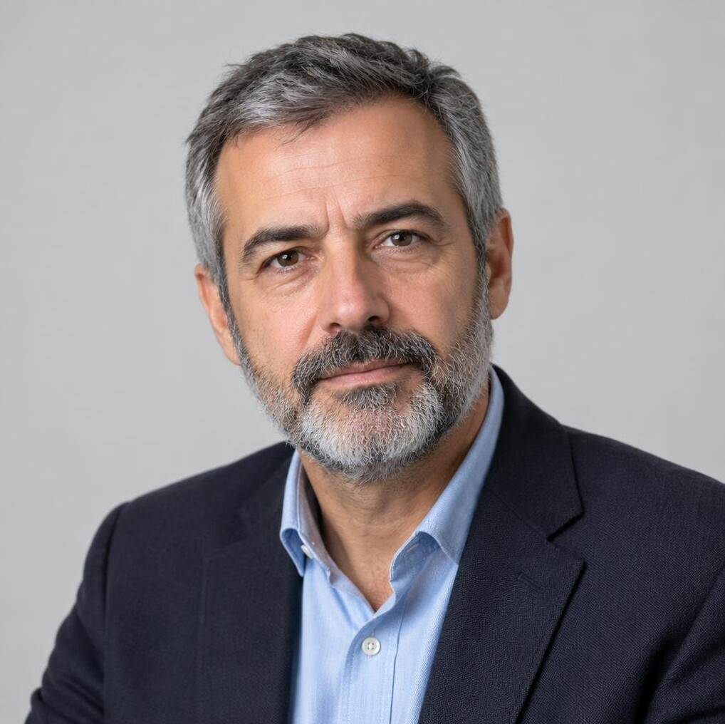 Studio portrait of a Portuguese man urban affairs reporter in his fifties